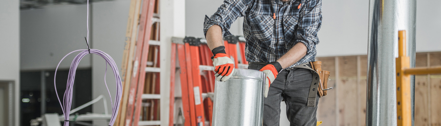 Worker Installing Duct