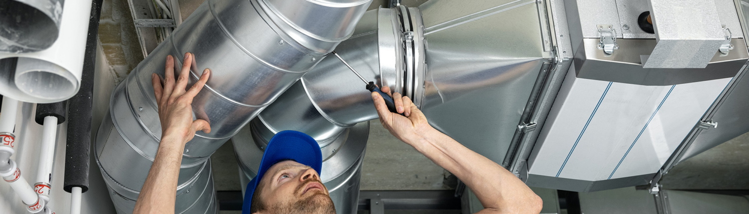 Worker Installing Ductowrk